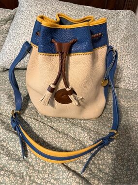 Dooney & Bourke Cream and Blue Leather Drawstring Bucket Bag with Yellow Trim